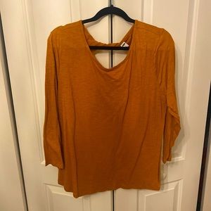 Burnt orange 3/4 sleeve top with back twist detail